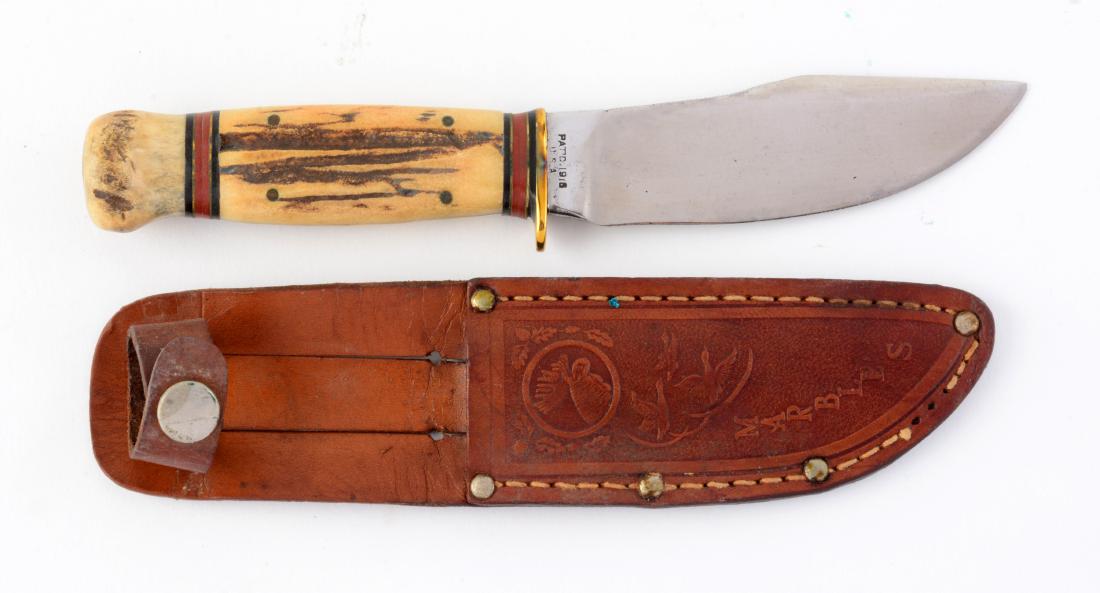Gladstone Mich. USA "Woodcraft" Stag Handled Sheath: Flat ground Skinner with thumb grooved back. Handled in stag with stag crown and brass half guard. Incorrect Marbles sheath. This is an old knife in a later made sheath). Circa pre 1943.Blade Length: