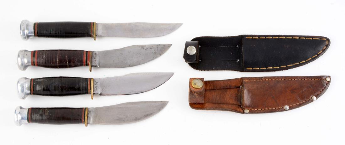 Lot of 4: Marbles Fixed Blades.: Knife A) Woodcraft: Skinner blade with thumb grooved back. Correct leather sheath signed "Marbles" on safety snap. Knife B) Woodcraft: Skinner blade with thumb grooved back. No sheath. Knife C) Expert