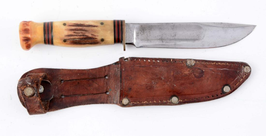 Marbles Gladstone Mich. USA 5" Stag Handled "Ideal".: Clip point blade with blade fullers. Handled in stag with stag crown and brass half guard. Unoriginal sheath. Circa pre 1943. Blade Length: 5"Overall Length: 8-3/4"