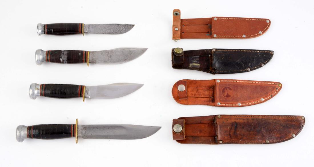 Lot of 4: Marbles Fixed Blades.: Knife A) Woodcraft: Skinner blade with thumb grooved back. Brass half guard. Circa pre-1943. Sheath is late production Marble sheath. Knife B) Ideal: Clip point blade with fullers. Full brass guard wi