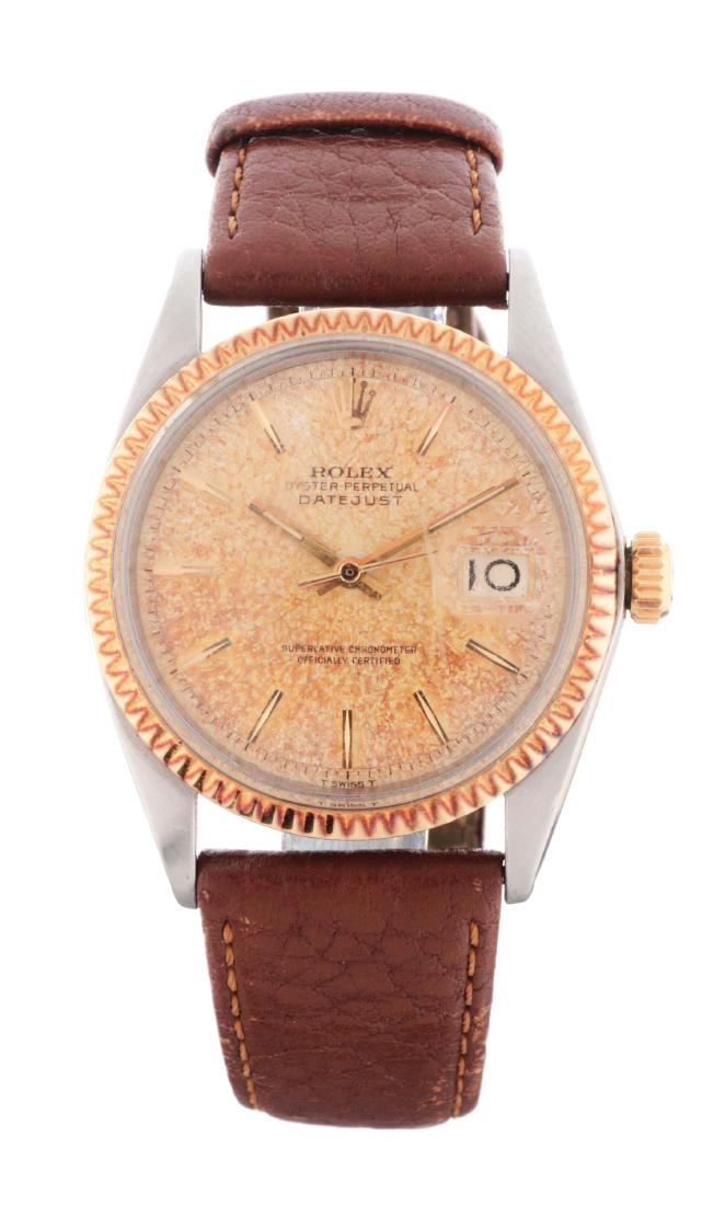 Tropical Dial Rolex Stainless Steel with 18K Yellow: Tropical Rolex Stainless Steel with 18K Yellow Gold Bezel Datejust Uni-Sex Reference. 1601 Case Serial 1232xxx. 36mm case diameter. Adjustable replacement leather strap. Replacement buckle. Winds, set