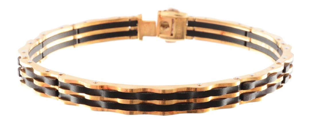 18K Yellow Gold & Black Metal Chimento Bracelet.: This lot consists of an 18K yellow gold and black metal bracelet, approximately 8-1/2" long. The bracelet is similar to an ID bracelet in construction, with one longer link in the center. It also has