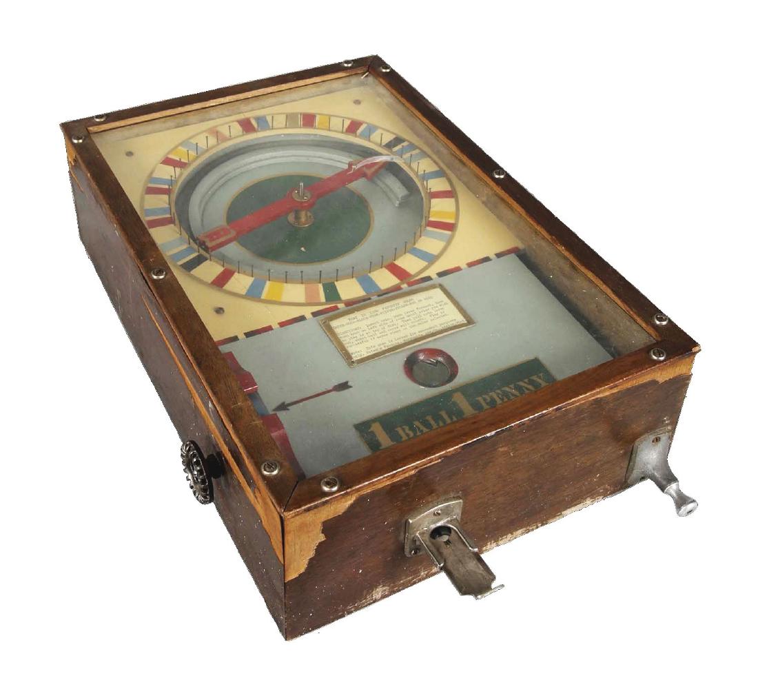 1¢ Merchants Advertising Co. Color Match Game.: This is a simple yet fun counter top game! After inserting a penny, player uses the left wheel to choose a color the pointer will land on. Pull the coin slot and the pin ball is released. Shoot the pi