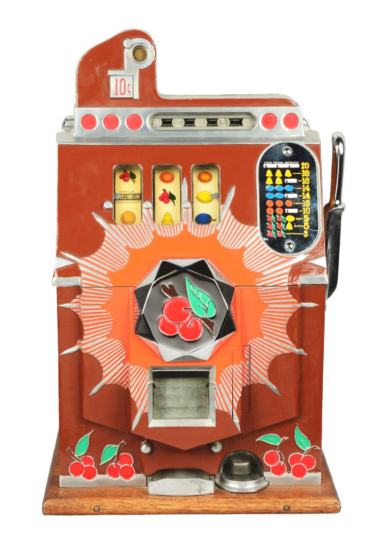 **10¢ Mills Bursting Cherry Slot Machine.: This slot machine exhibits an older restoration, featuring a brown front, an array of vibrant colors, escalator bell, and wonderful wood finish. In working condition. Two keys are provided. Condition: