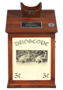 5¢ Exhibit Supply Co. Duoscope Viewer Arcade Machine.: After inserting a nickel, approximately 15 intriguing slides are able to be viewed. The cog found on the right side of this mahogany housed device allows the movement of the pictures. Average sized tr