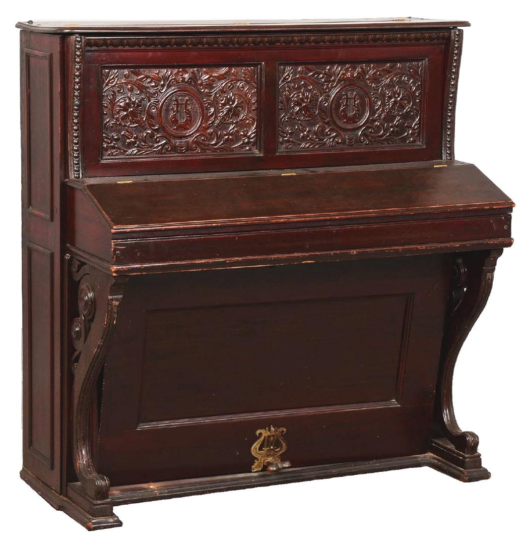 Little Jewel Piano.: This upright piano made of dark walnut is in good condition due to perfect working order. However, there are visible scratches that can be seen along the top. It has a beautiful Victorian design with 