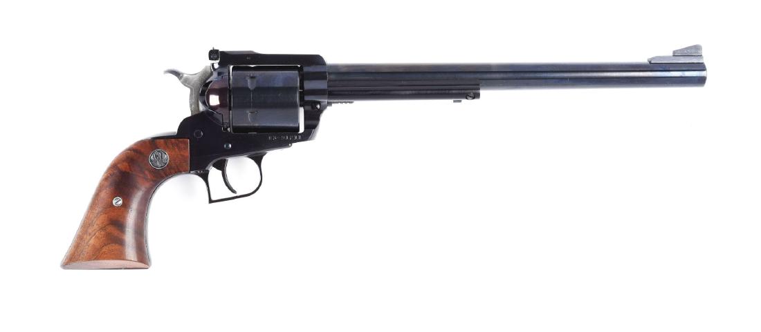 (M) Boxed Ruger .44 Mag Buntline Super Blackhawk: Scarce revolver that features a six shot, single action with blue finish , target rear sight and high ramp front with walnut logo grips. There are a couple storage spots on barrel and a light drag lin