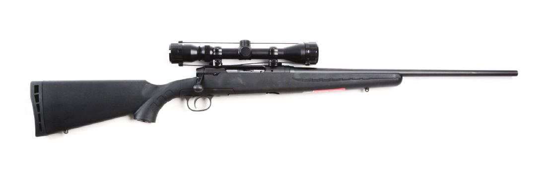 (M) Savage Axis Model Bolt Action Rifle.: Features matte black round tapered barrel, right hand bolt action with composite pistol grip stock. Three round detachable box magazine, and tang safety. Topped off with a Bushnell 3-9 Variable scope.
