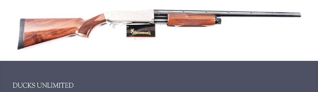 (M) Browning BPS Field Grade Ducks Unlimited 1999 Slide: Blued barrel with vented matte rib, and single bead. Stainless steel action with stamp engraved duck scenes on both sides and both sides engraved "DUCKS UNLIMITED" including logo. Partially figured va