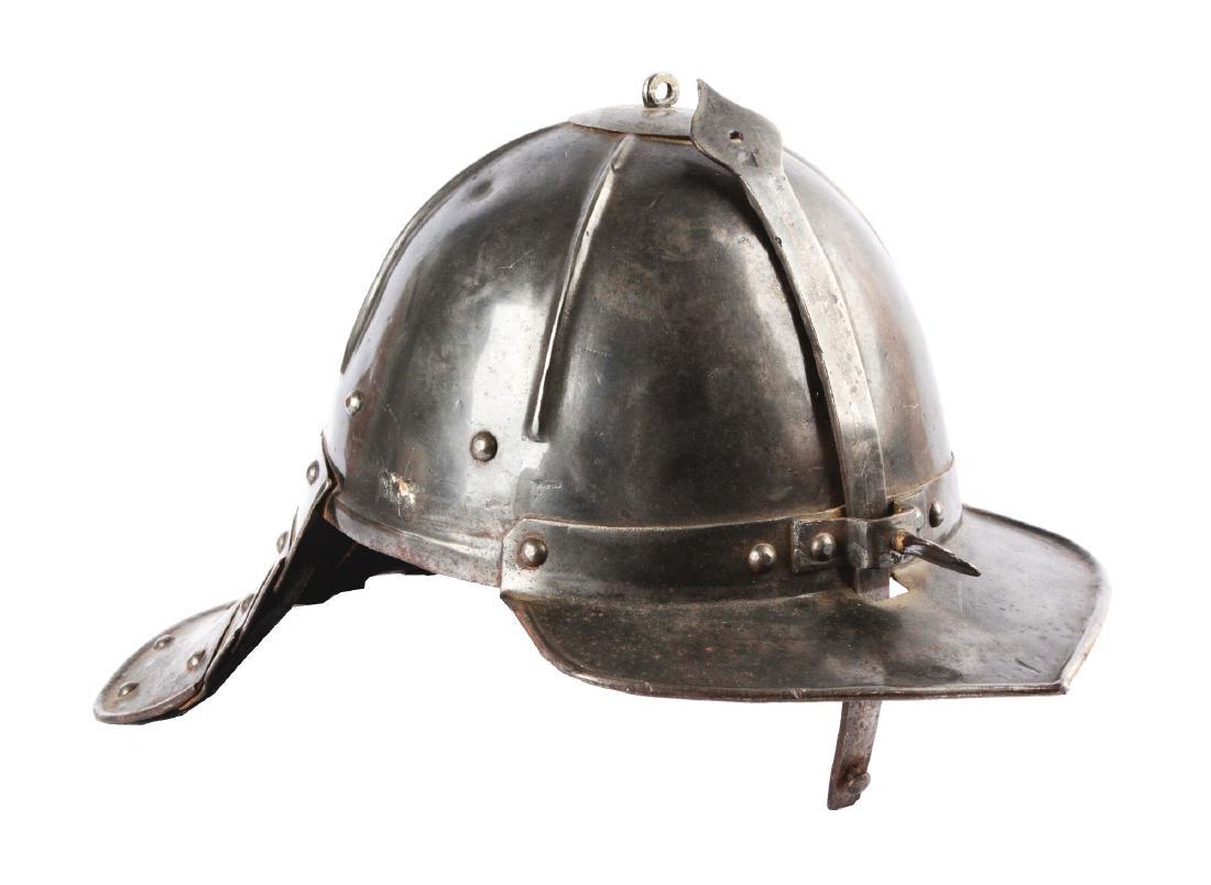 Cromwellian Lobster Tail Helmet or Ziscahagge.: An English 17th century zischagge, pot-shaped and ribbed skull forged in one piece with attached visor with ribbed brim on front and lobster tail neck defense on back with four riveted lames. Sliding 