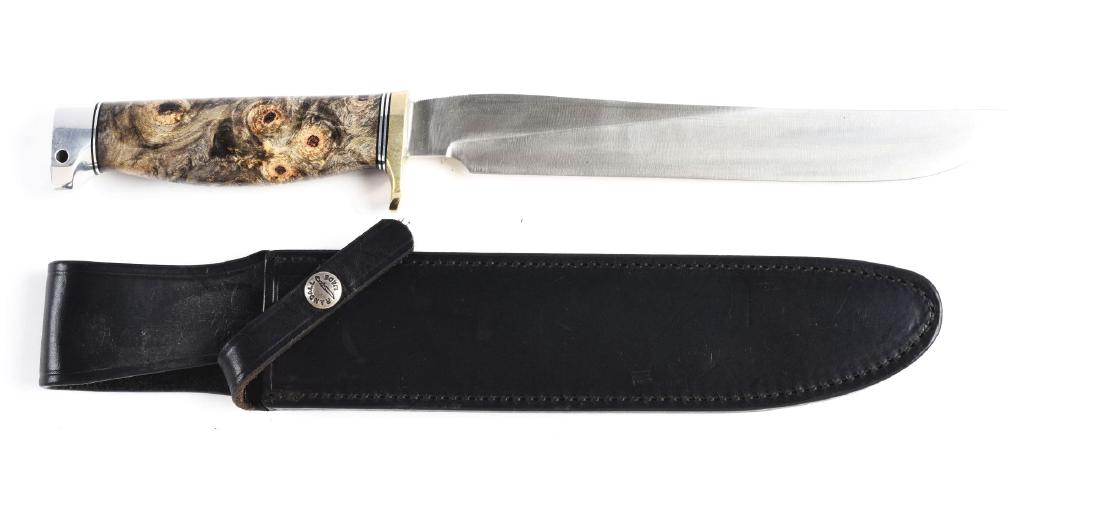 Randall Made - Orlando, Florida Model 9 Fixed Blade: A type of camp knife slimier to a RANDALL carving knife with a 9" blade, overall of 14", handled in composite hard wood with a heavy nickle silver half guard with a birds head pommel. Correct signed s