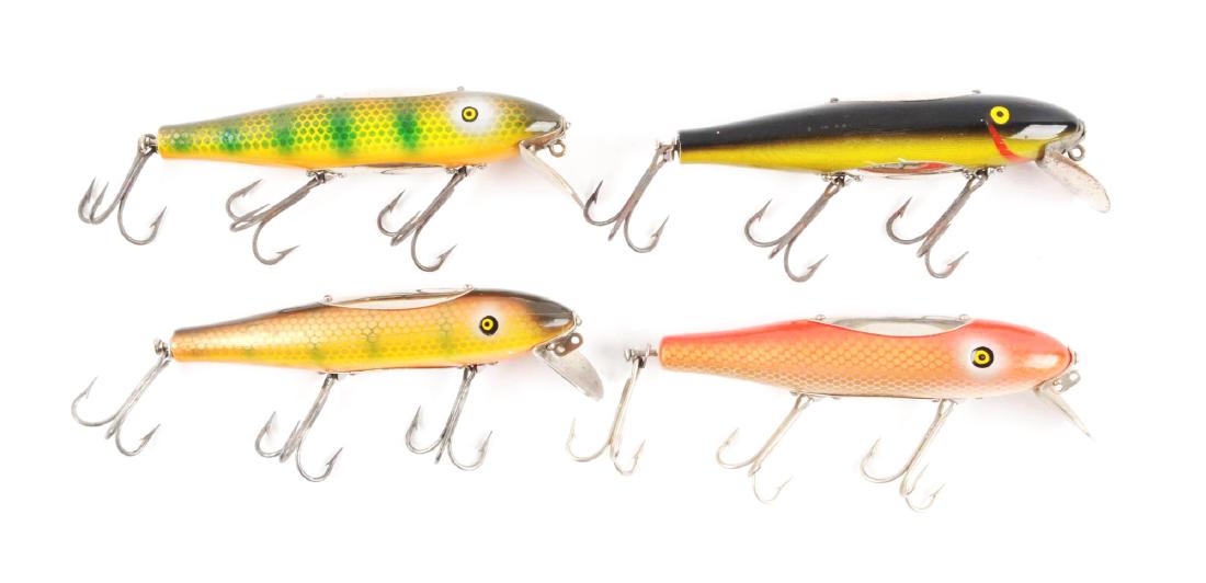 Lot of 4: Pflueger Saltwater Mustangs.: Group includes an Eel finish, Squid finish, and a pair of Sunfish scale baits. All are in about excellent condition.