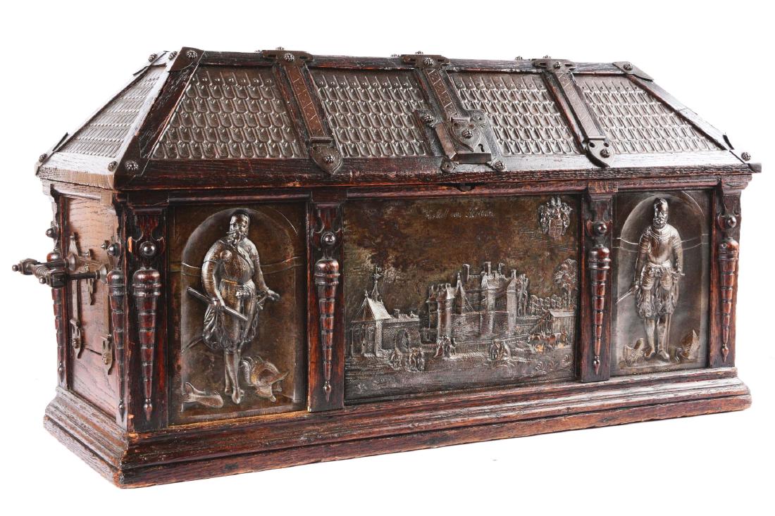 Large Gothic Revival Armorial Coffer Featuring Kasteel: Constructed of oak and tin. The front with a large tin panel in the center, displaying a detailed repousse scene of the Belgian castle Herlaar and inscribed "Kasteel van Herlaar". On each side, detail