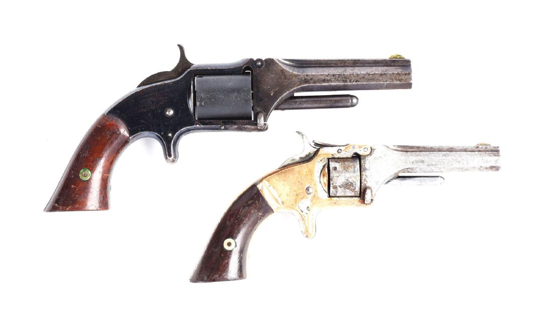 (A) Lot of 2: S&W Tip-Up Spur Trigger Pocket Revolvers.: Gun (A) Smith & Wesson Model No. 1 Second Issue revolver manufactured 1860 to 1868. Features seven shot, non-fluted cylinder, tip-up, spur trigger, brass frame, square butt grips. Traces of plating on