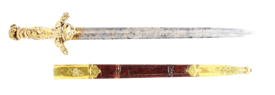 Fine German Presentation HirschfÃ¤nger Hunting Sword.: An exquisite German high quality and detailed hunting sword. Double edged Damascus steel blade with twin fullers on each side, adorned with detailed etched motifs and gilt finish highlights. Designs i