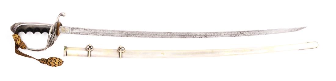 Pre WWI U.S. Model 1902 Officer's Identified: Slightly curved single-fullered steel blade, etched panels nearly the entire length on both sides. The right side with detailed scrolls, military motifs, arms, and "PRESENTED/Edward M. Fielding/BY THE