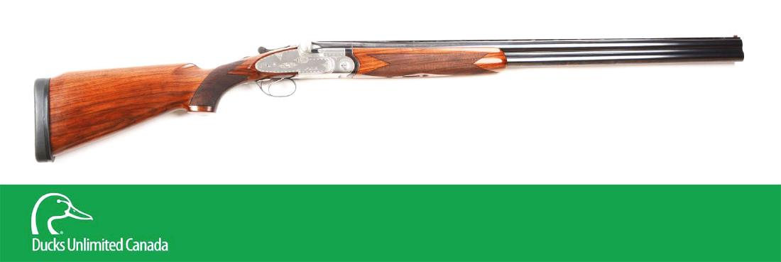 (M^) Beretta SO4 Sidelock Over and Under 12-Bore: Manufactured in 1971, this shotgun was rated one of the world's greatest shotguns. Round blued steel superposed barrels with vented matte rib with orange fiber-optic bead, flared breeches. Stainless s