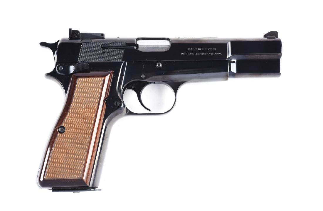(M) Belgium Browning 75th Anniversary Hi-Power: Manufactured in 2010, this special edition features factory high polished blue finish, white line target adjustable rear sight, white line front sight, dark walnut checkered grips, double action semi-