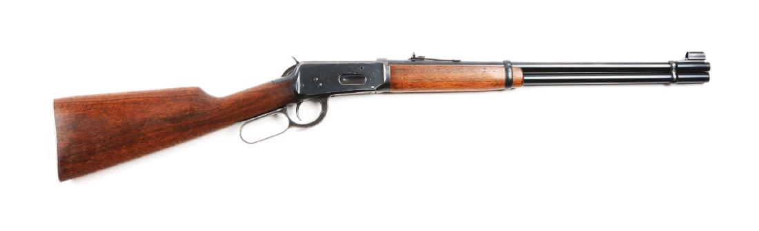 (C) Winchester Pre - 64 Model 1894 Lever Action: Manufactured in 1962. Features full round barrel, double barrel bands, full magazine, ramp front sight with hood sporting rear sight, walnut stocks, and steel shotgun buttpad. Barrel and tube retain a