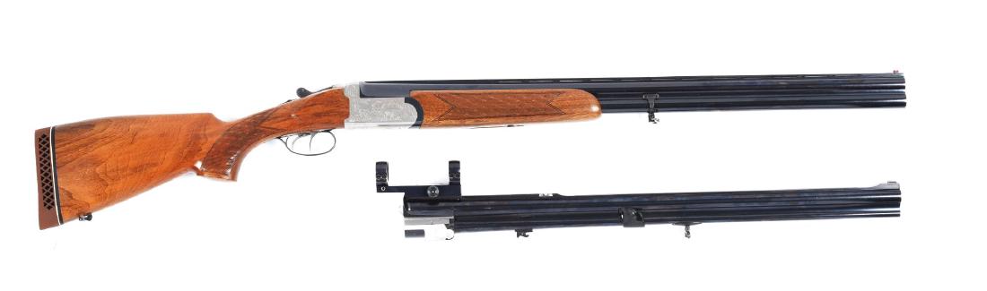 (M) Antonio Zoli Safari Deluxe II Combination Gun.: Shotgun barrels retain 97% blue and features an integral sling swivel and vent rib. Mirror bores and automatic ejectors. Numbered to gun. Combo barrels are blued with pop-up rear sight, matted rib, br