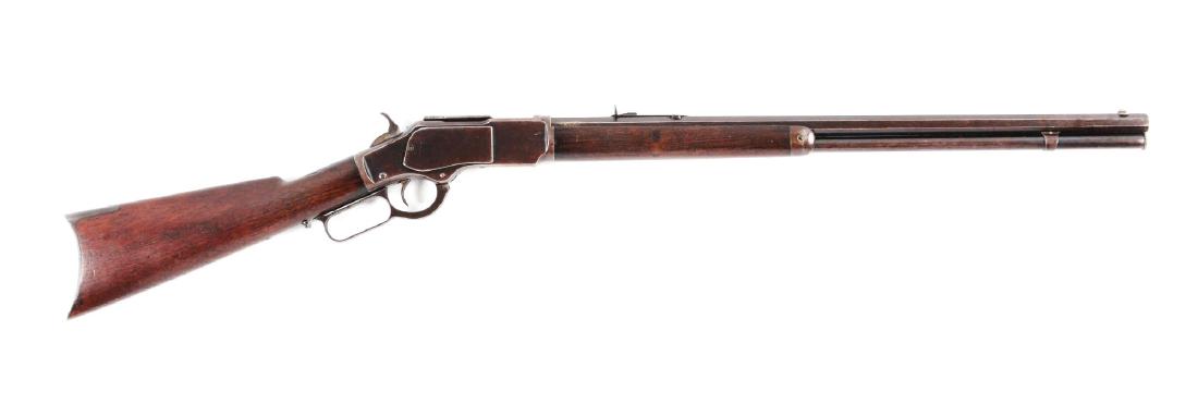 (A) Winchester Model 1873 .22 Caliber Lever Action: Manufactured 1888. Features full octagon barrel, full magazine, sporting front sight, semi-buckhorn rear sporting sight, blued finish, walnut stock, rifle butt. Barrel and tube are a pleasing mix of b