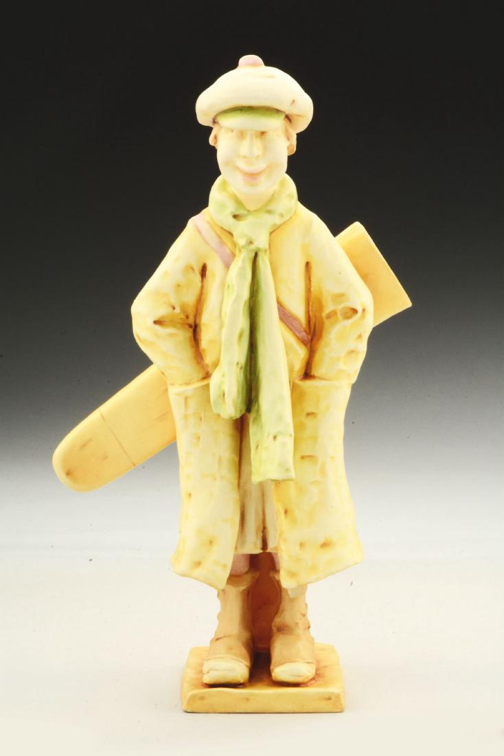 Amphora Ceramic Whimsical Figure of a Golf Caddy.: Amphora oval mark, 66, 4460. An example of the model is illustrated in "The House of Amphora", Richard Scott, page 123.Condition:(Mint).Dimensions:13 - 1/2" x 9".