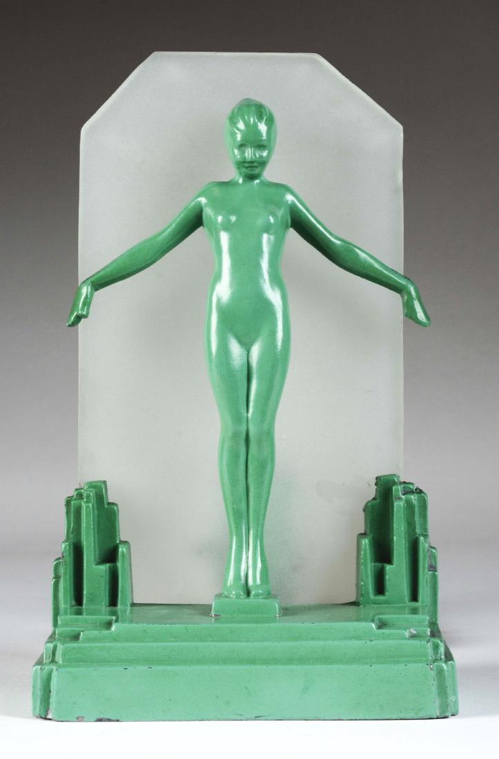 Frankart Green Metal & Frosted Glass "Silhouette" Lamp.: Lamp with two nude figures. Model L212. Circa 1929. Impressed Frankart, Inc.Condition:(Mint).Dimensions:10 - 3/4" x 6 - 1/4".