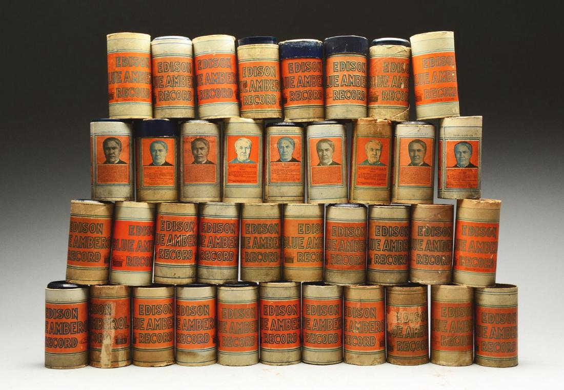 A Large Lot of Edison Blue Amber Records.: This lot consists of approximately 20 Edison blue amber records and approximately 15 empty containers. Please note that most are without lids. Overall the pieces are in good condition with normal wear