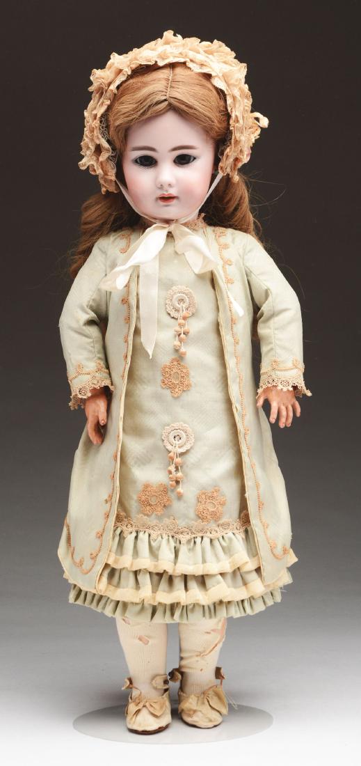Simon & Halbig 939 Character Child.: 23". An early example with oily bisque, square cut teeth (tiny chip on one tooth), very large dark brown glass sleep eyes affixed upon an early style composition and wood body with original finish. Re