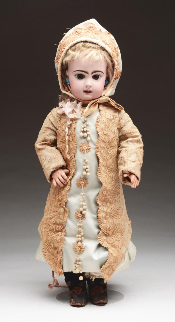 Open Mouth Tete Jumeau #10.: A later period Tete Jumeau with an open mouth and upper row of teeth. This doll at first glance appears to be smiling or laughing. Extremely large brown paperweight eyes, long panted lashes and soft e
