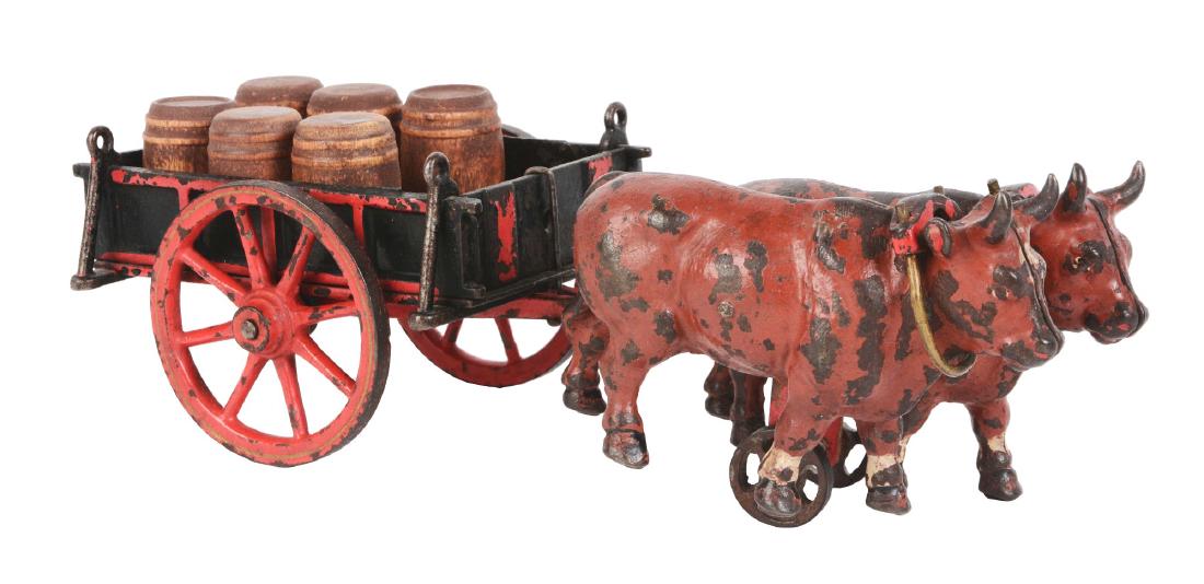 1883 Welker Crosby Ox Drawn Cart: Wooden barrels in the cart. Original back gate. Some paint loss to wheels and oxen. Dimensions: 11 -1/4" x 4". Condition: (Very Good - Excellent).
