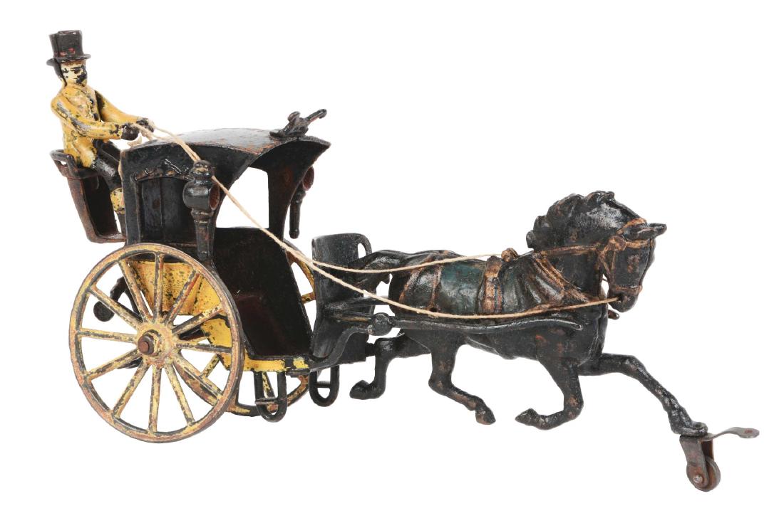 Pratt and Letchworth Hansom Cab: Includes original driver. Pulled by one horse. Some moderate paint loss throughout. Dimensions: 12" x 3". Condition: (Very Good).