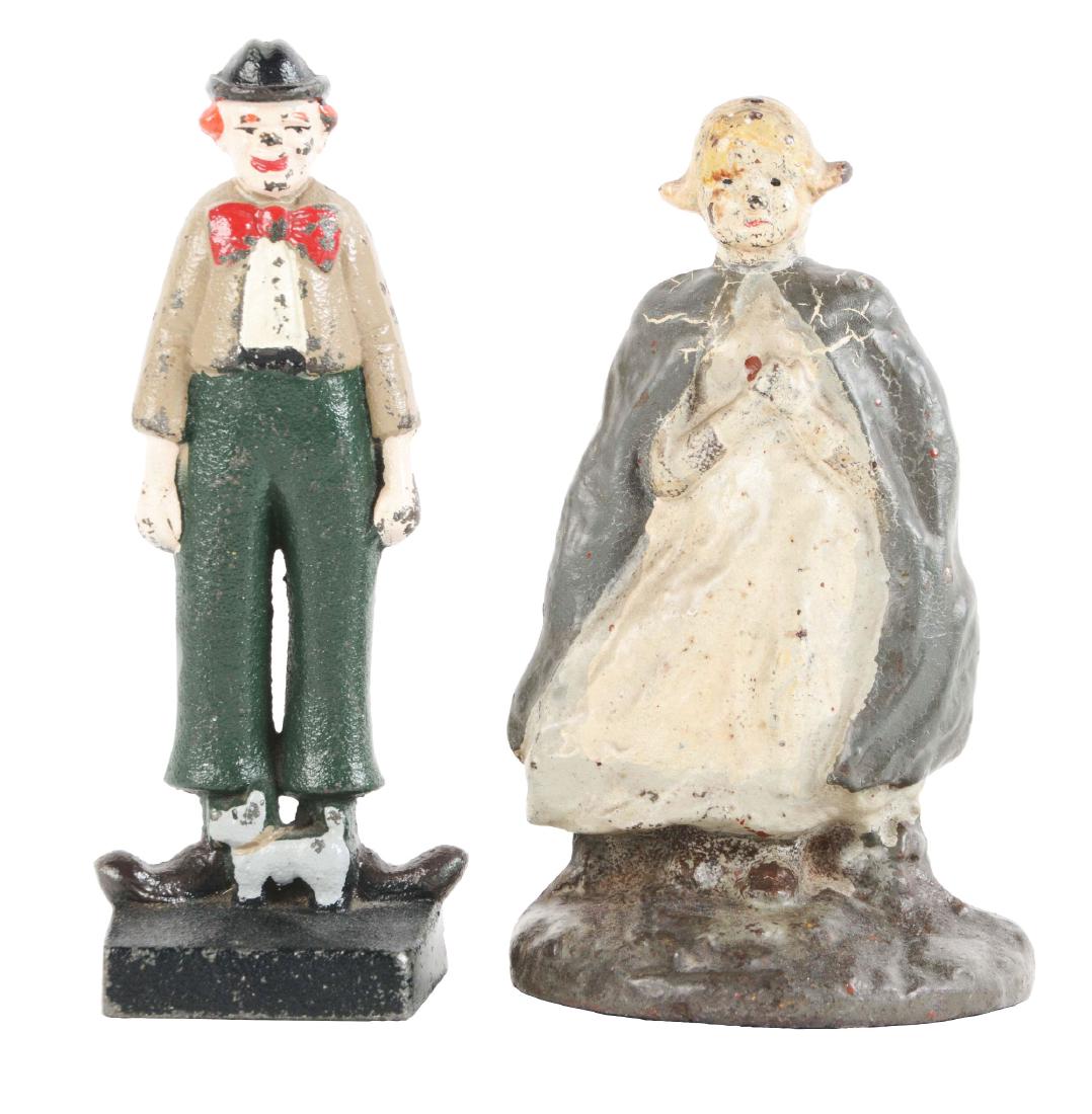 Lot of 2: Cast Iron Figure Doorstops.: Lot includes a full-figure, solid casting Nurse and a full-figure, solid casting clown with Scottie dog, John Wright. Each a book example. Dimensions: Largest: 7 - 1/2" T. Condition: (Excellent).