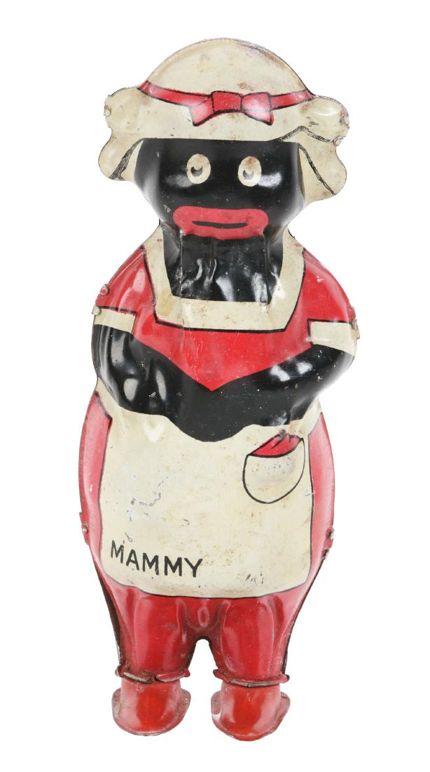 Linstrom Tin Litho Wind Up Mammy Toy.: Depicts African American woman in apron. Marked "Mammy" on the front. Some scratching and wear throughout. Dimensions: 7 -1/2" x 3 -1/4". Condition: (Very Good).