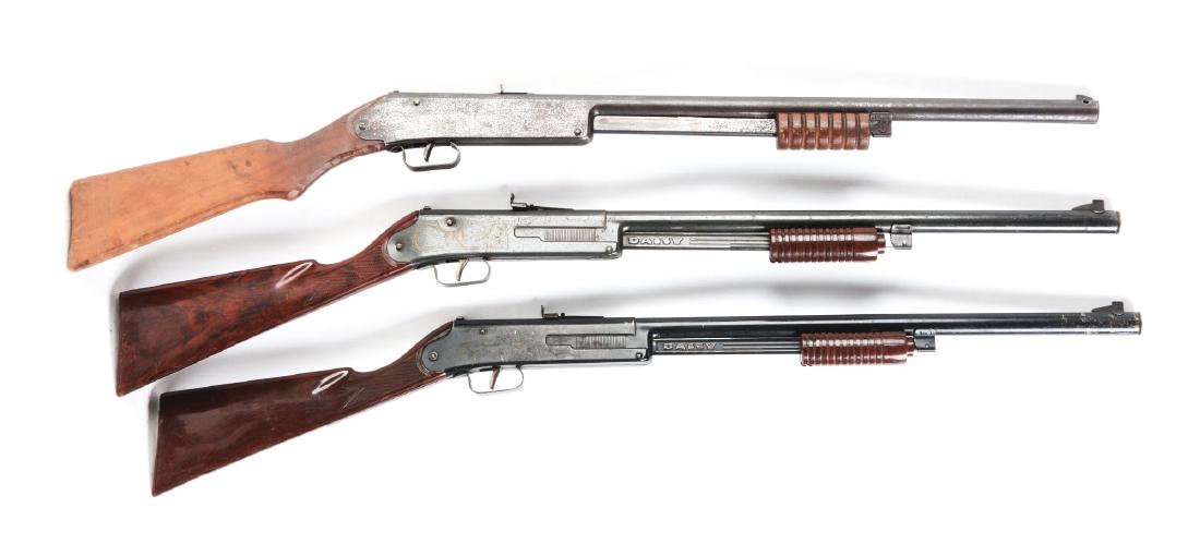 Lot of 3: Pump Action Air Rifles.: Gun A) King No. 5 Pump Gun. .177 lead air rifle shot caliber, SP, 60 shot gravity-fed magazine, six groove wooden cocking slide, pistol grip stock. Overall length 36â€. Same design used by Daisy fo
