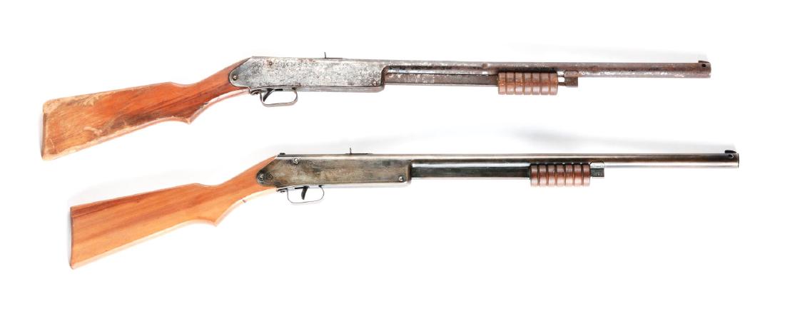 Lot of 2: Daisy Model 107 Buck Jones Special Air: Gun A) slide action(does not work), 40% blue finish remains, sundial markings on wooden stock, floating compass is missing. 60 shot gravity-fed magazine. Manufactured 1934-42. This gun has very heavy
