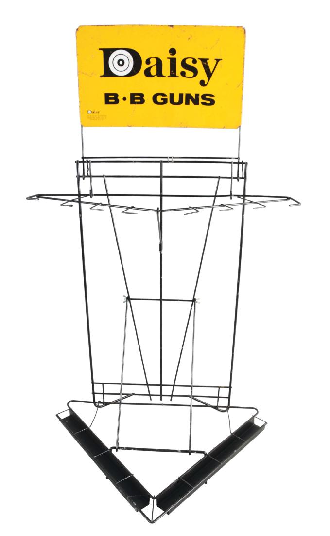 Vintage Daisy Tin Litho & Metal Wire BB Gun Display.: Marked "Daisy BB Gun Division, Rogers, Ark. Most likely a store display for a sporting goods store or department store. Some scratching to the front. Dimensions: 45" x 27 - 1/2". Condition: