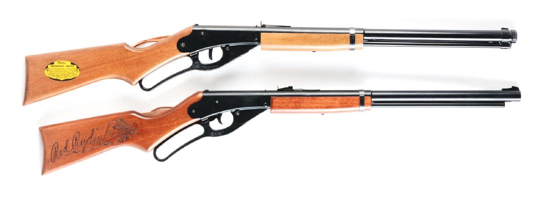 Lot of 2: Daisy Model 1938 Air Rifles.: Both are BB/.175 caliber, Red Ryder similar to No. 111 Model 40 air rifles, wood stock and forearm, logo stamped on left side of stock, saddle ring with leather thong. Gun A) Retains nearly 99% of ori