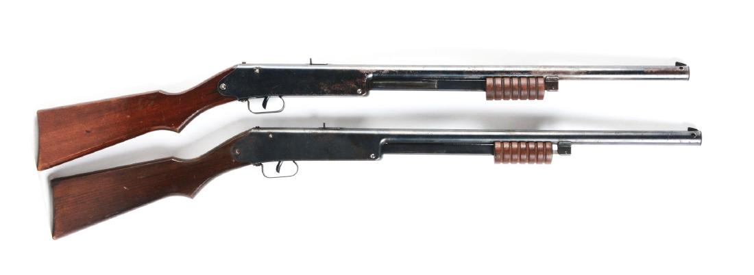 Lot of 2: Markham King No. 5 Pump Air Rifles.: Both are .177 lead air rifle shot caliber, 60 shot gravity fed magazine, six groove wooden cocking slide, pistol grip stock. Overall length 36". Same design used by Daisy for No. 105 junior pump gun a
