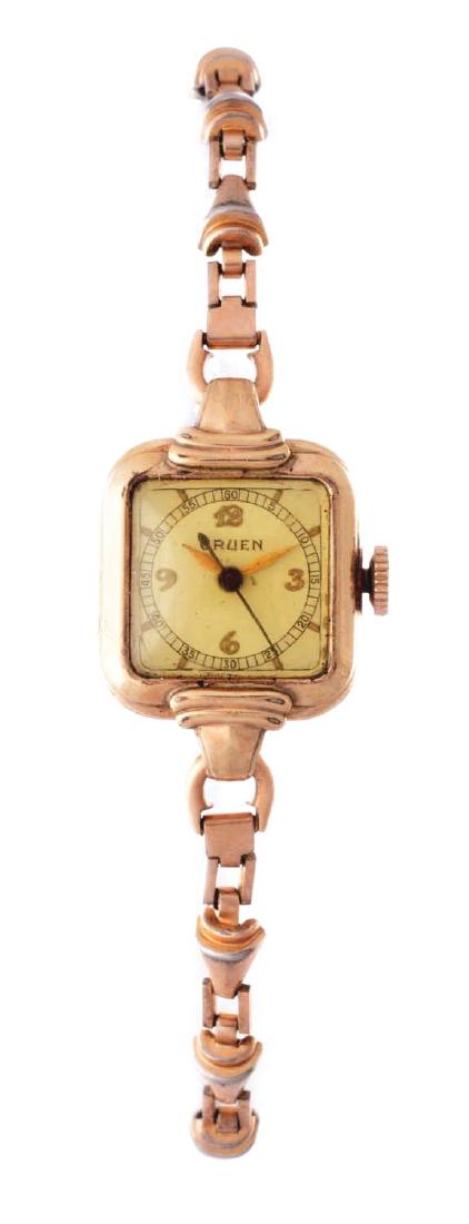 Vintage Gruen Gold Filled Ladies Wristwatch.: Vintage Gruen Gold Filled Ladies Watch with box. The case measures 17mm by 17mm in diameter. The dial is off-white featuring arabic numeral hour markers. Original box included. Condition: (Very Good).