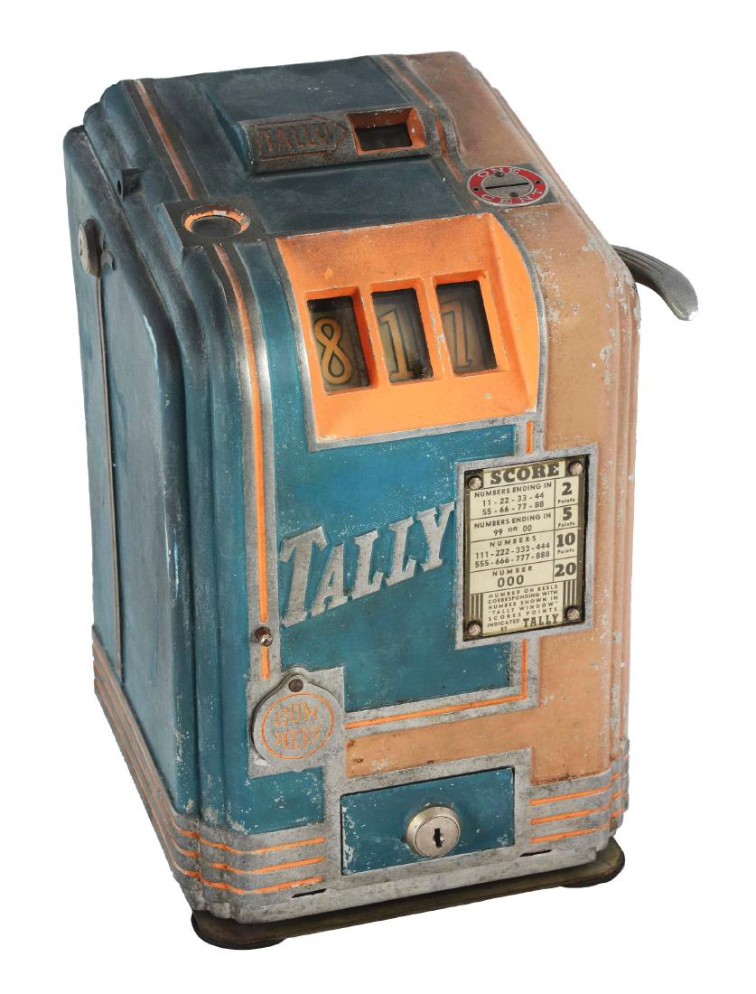 **1¢ Daval Tally Trade Stimulator.: Countertop trade stimulator colored in dark green and orange, with a swivel base. 2 to 20 points can be achieved by players and are based upon the numbers spun on the reels. Gumballs can be collected