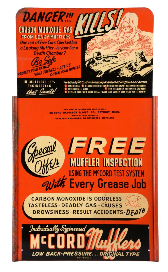 McCord Mufflers Tin Curb Side Sign with Skull Graphics. (1 of 2)