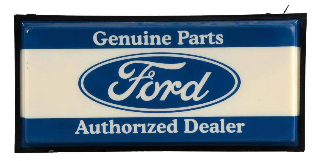 Ford Genuine Parts Authorized Dealer Light Up Store: A nice example of this light up display. Plastic face shows some light wear but is in overall very nice condition. Metal body is in excellent condition throughout. Sign lights up nicely and makes a gr