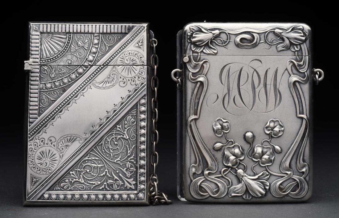 Lot of 2: Antique English Sterling Silver Victorian: The first is a Blackinton with embossed floral design and chain. The second is an embossed and engraved design with a chain. No damage or scratches to either.Condition:(Excellent).Dimensions:Each: 3 -