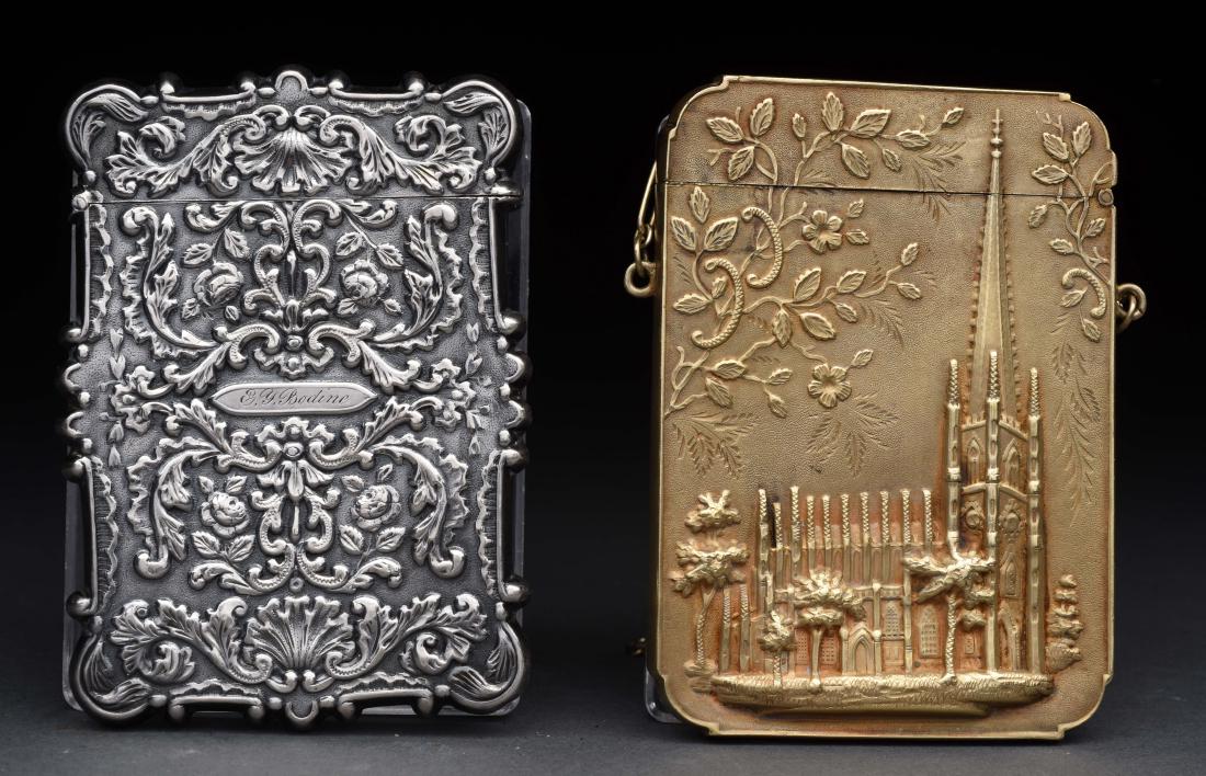 Lot of 2: Antique English Sterling Silver Victorian: The first is gold washed, Trinity Church, 1858 made by Leonard & Wilson (Philadelphia). The second is a sterling silver with an embossed cathedral, Trinity Church. No damage or scratches.Condition:(Ex