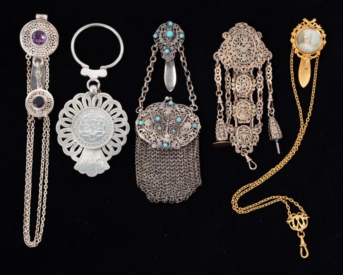 Lot of 5: Antique Victorian Chatelaines.: Lot includes: purse with butterfly and turquoise; French silver gilt with wax seal and watch key; sterling silver with coin; silver plated with two amethysts; and a hand painted lady hook. No damage.C