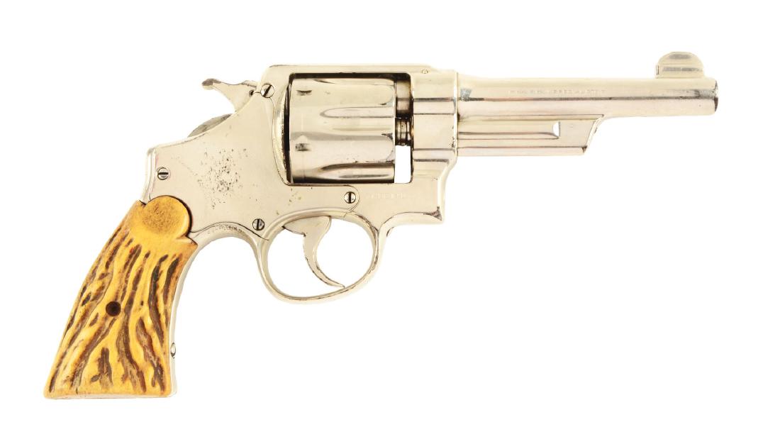 (C) S&W 3rd Model HE Wolf & Klar .44 Revolver.: Factory letter states this gun was shipped on February 24th, 1927 and delivered Wolf & Klar of Fort Worth, Texas. It left the factory with a 5" barrel, blue finish and checkered walnut grips. Built on