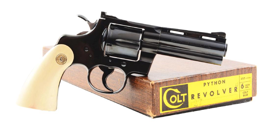 (C) Boxed Colt Python Double Action Revolver (1967).: Features include blue round barrel with ventilated rib. Ramp front and adjustable rear factory sights. Blue double action revolver with six shot fluted cylinder. Faux ivory stocks with silver Colt med
