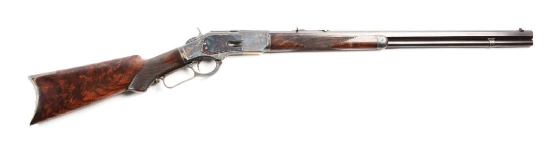 (A) Winchester Deluxe Model 1873 Lever Action Rifle.: Factory letter states that rifle Serial No. 200430 was shipped February 3rd, 1886 as an octagon rifle with set trigger, checkered stock, pistol grip and case hardened, which is how it remains today. F