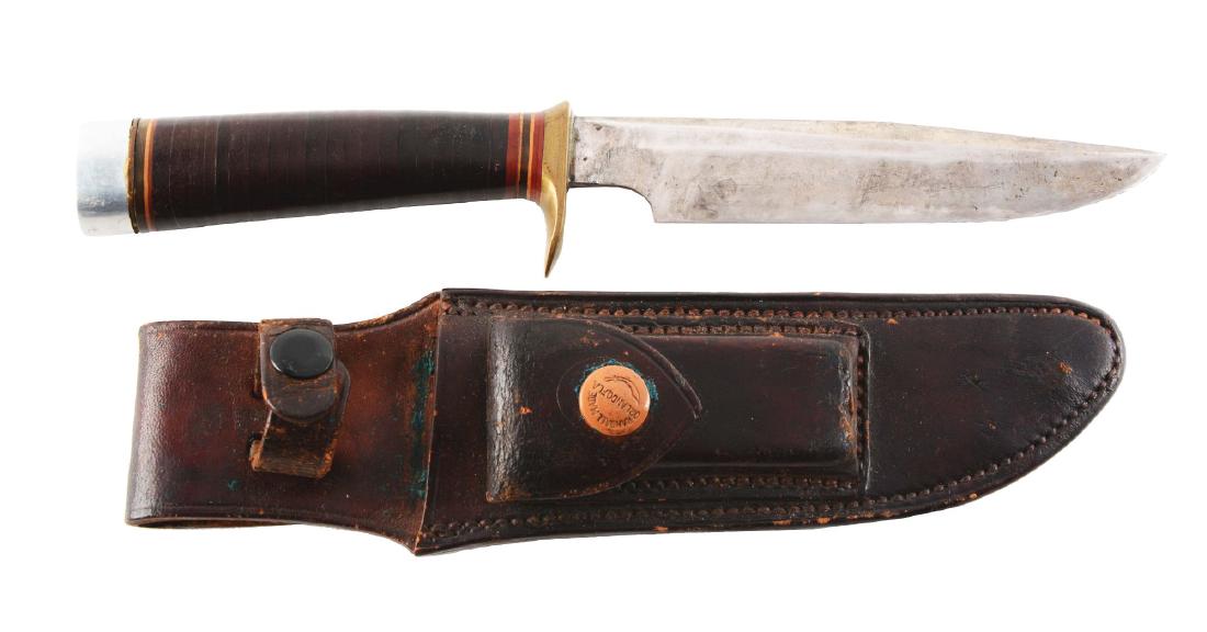 Randall Fixed Blade Knife.: Randall Made - Orlando, FLA 6" saber ground clip point blade; 10 - 1/2" overall. Handled in stacked leather with brass half guard and aluminum pommel. Tang nut has been removed. Correct leather sheath